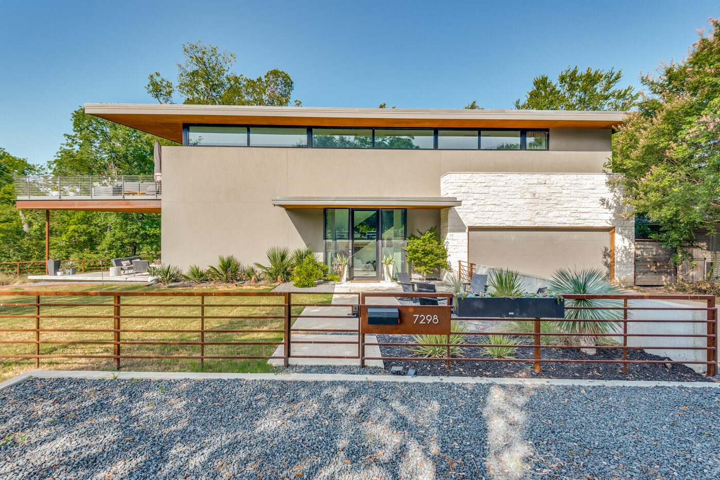 Exterior of contemporary home, fenced in