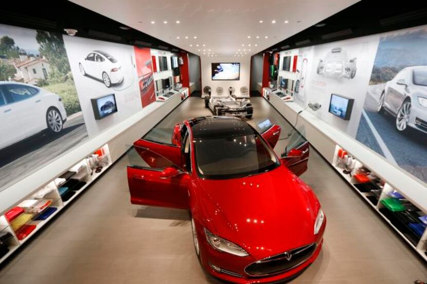 Tesla Motors’ new gallery at NorthPark Center can’t actually sell cars because the company...