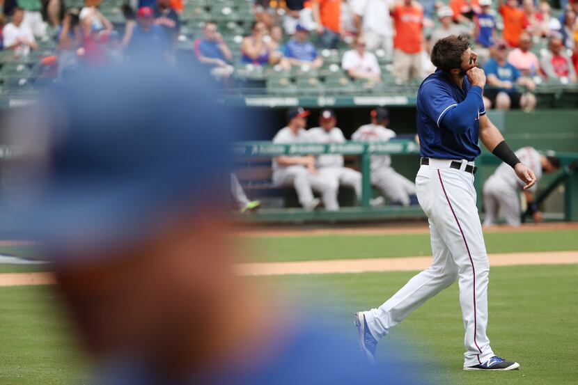 FILE - Rangers slugger Joey Gallo reacts after striking out to end the second inning of a...