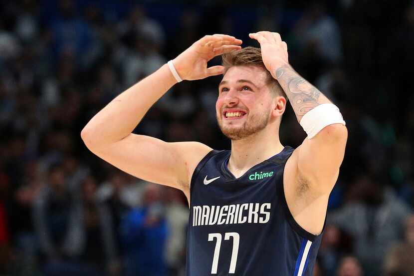 Dallas Mavericks forward Luka Doncic (77) reacts to a missed 3-point attempt by Tim Hardaway...