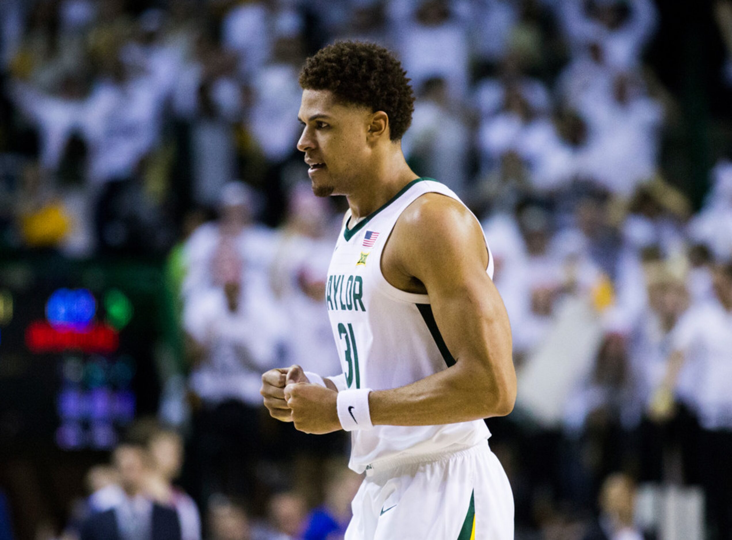 Baylor Bears guard MaCio Teague (31) celebrates after making a three-pointer to narrow the...