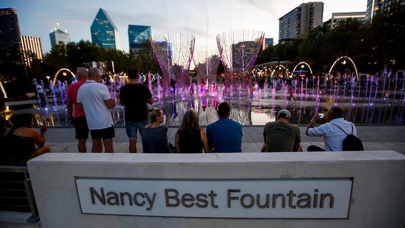 People watch the Nancy Best Fountain while it was being unveiled with its first nightly...