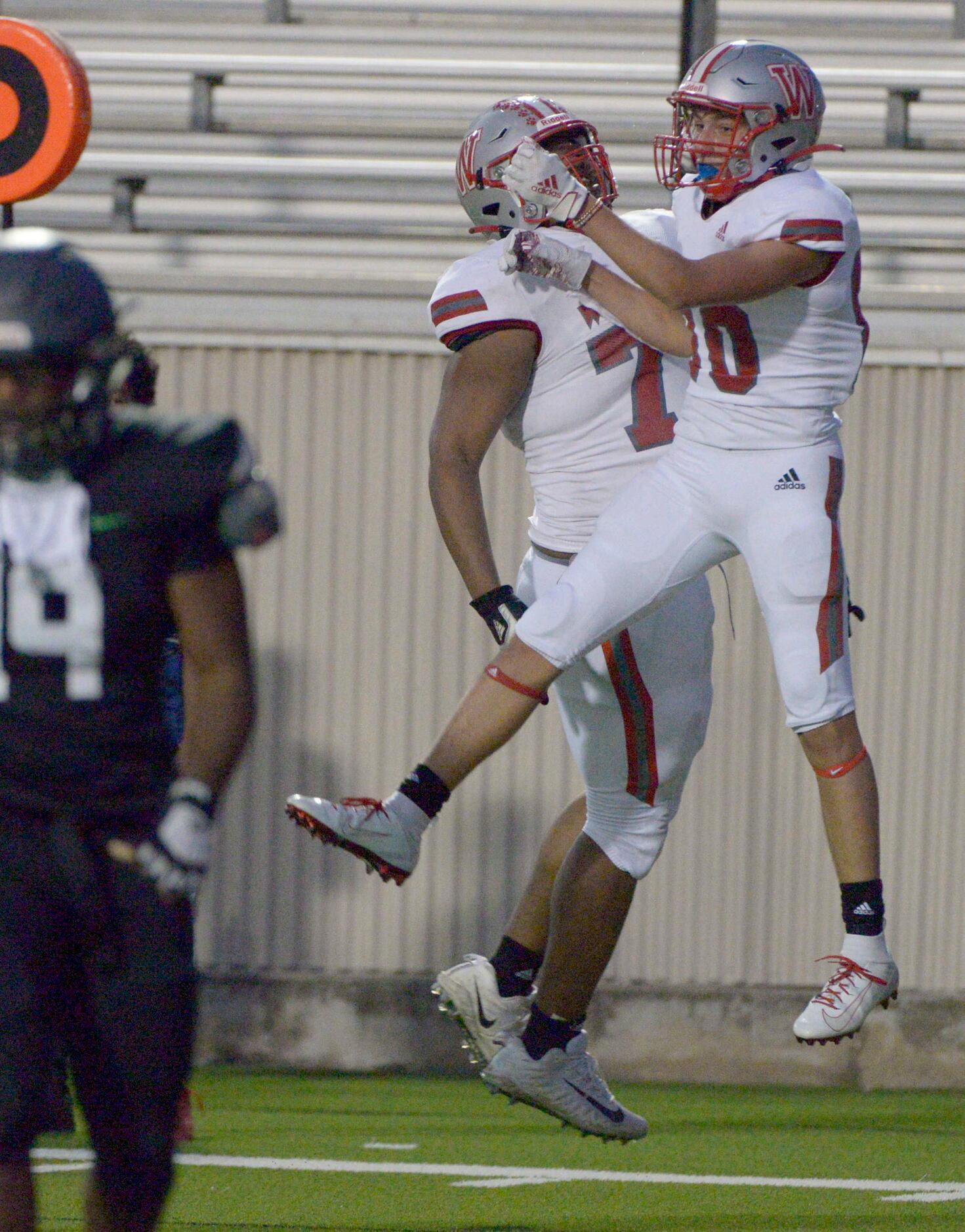 Woodrow Wilson’s Evan Rae, right,  celebrates after his touchdown reception in the first...