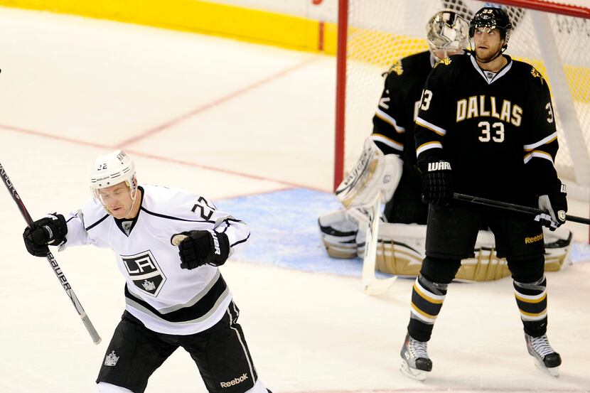 Los Angeles center Trevor Lewis (22) celebrates after a third period goal as Dallas...