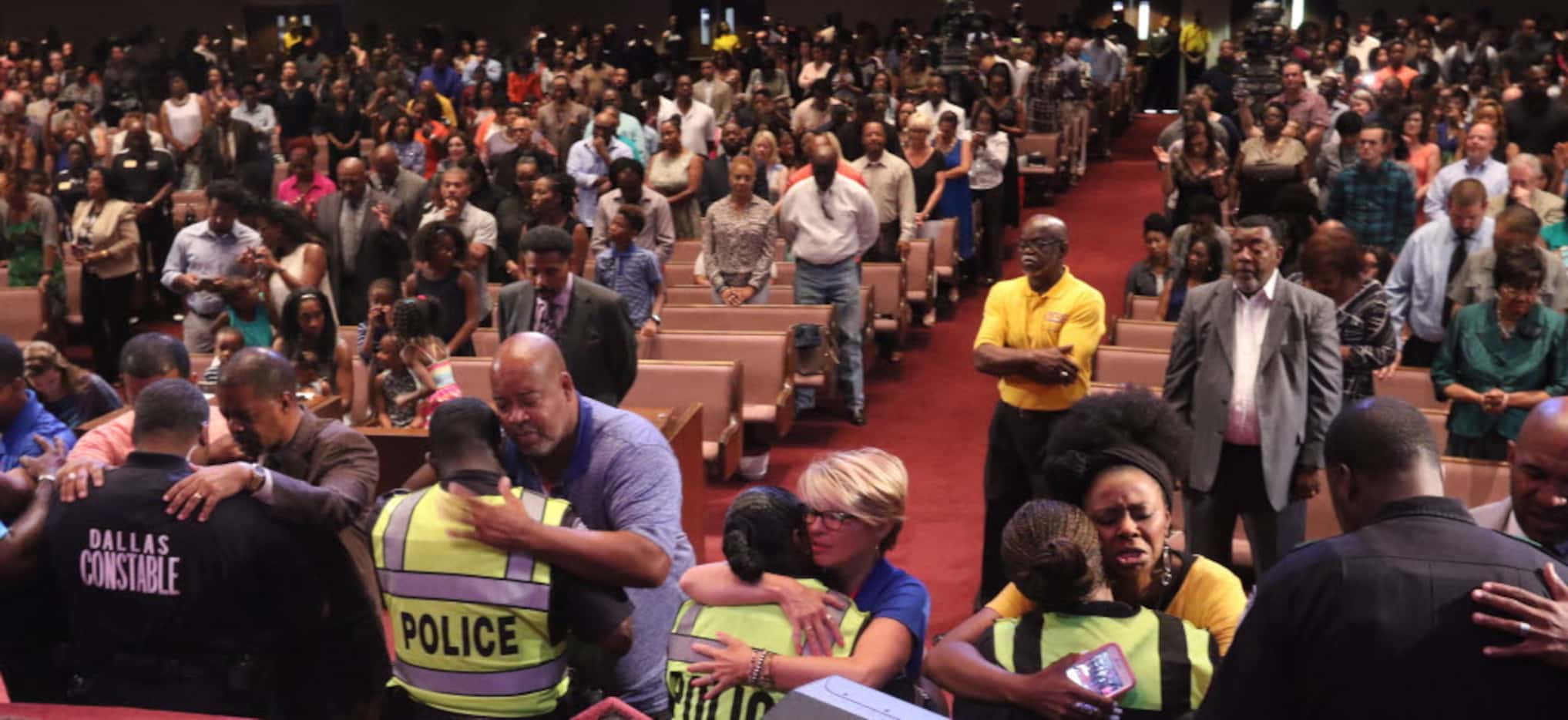Dr. Tony Evans and members of Oak Cliff Bible Fellowship pray for law enforcement officers...