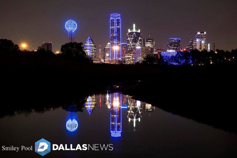 The downtown Dallas skyline lights up in blue in recognition of National Police Week on Monday.