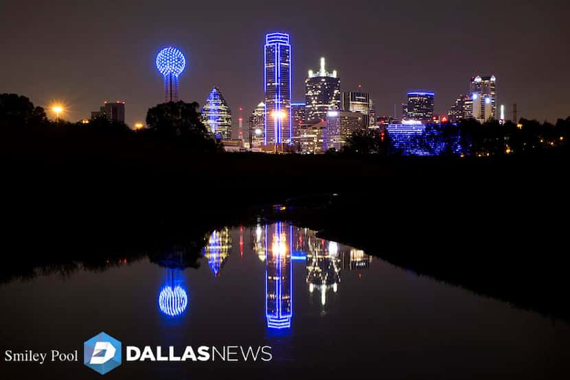 The downtown Dallas skyline lights up in blue in recognition of National Police Week on Monday.