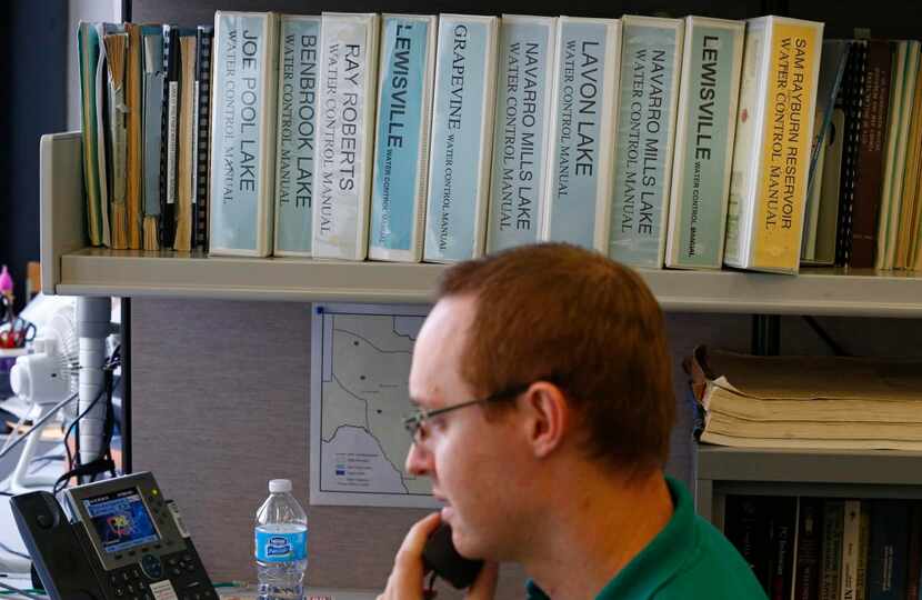 
Corps of Engineers hydrologist Max Strickley answers the phone at the Fort Worth office....