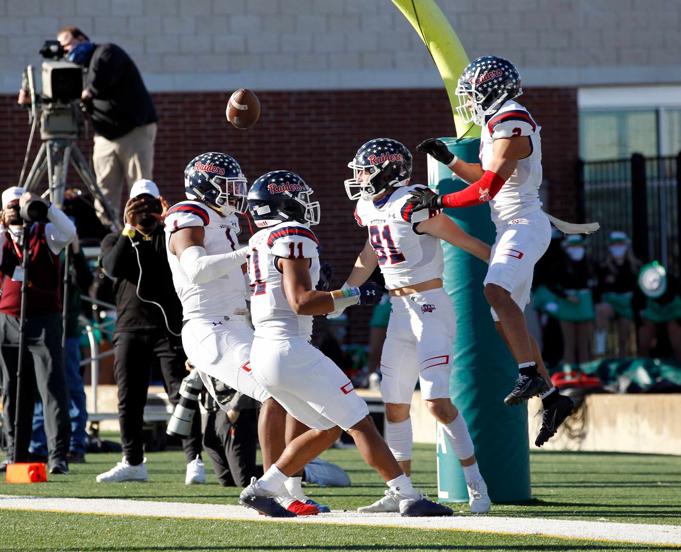 Denton Ryan’s  Keagan Cunningham (81) celebrates with teammates in the end zone, after...