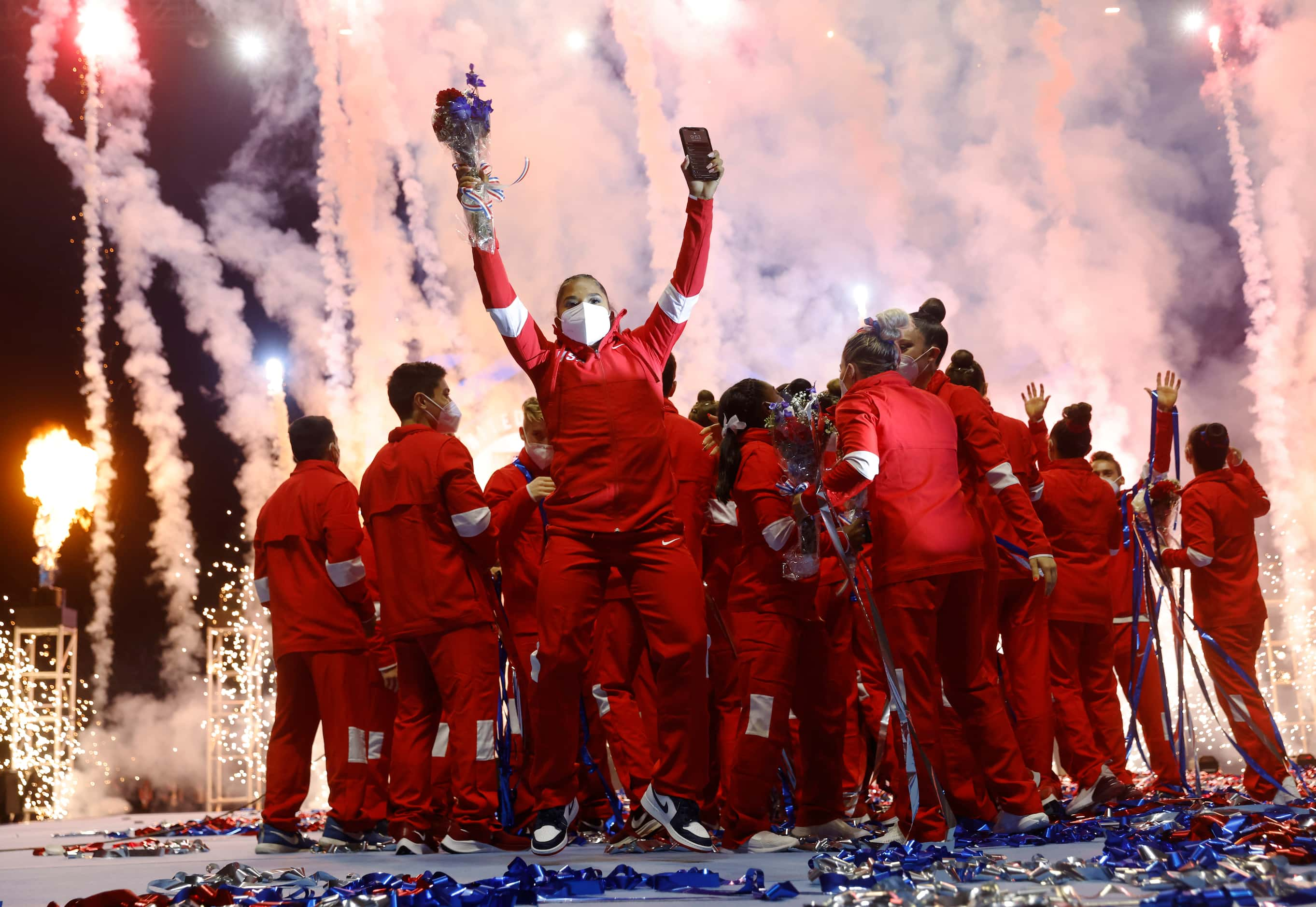 Jordan Chiles celebrates withe the men's and women's U.S. Olympic gymnastics team celebrate...