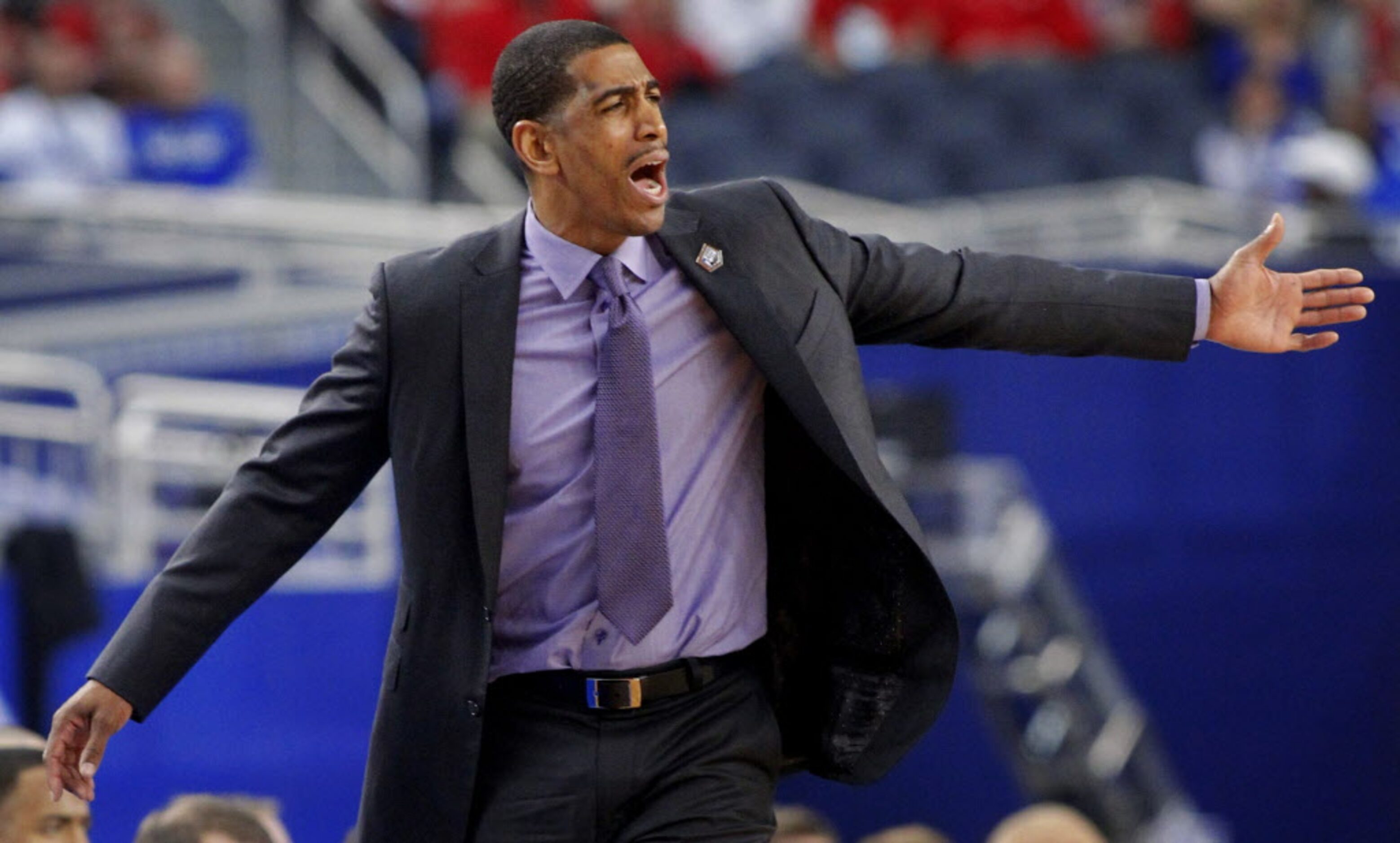 Connecticut Huskies head coach Kevin Ollie reacts to a call during the first half of their...