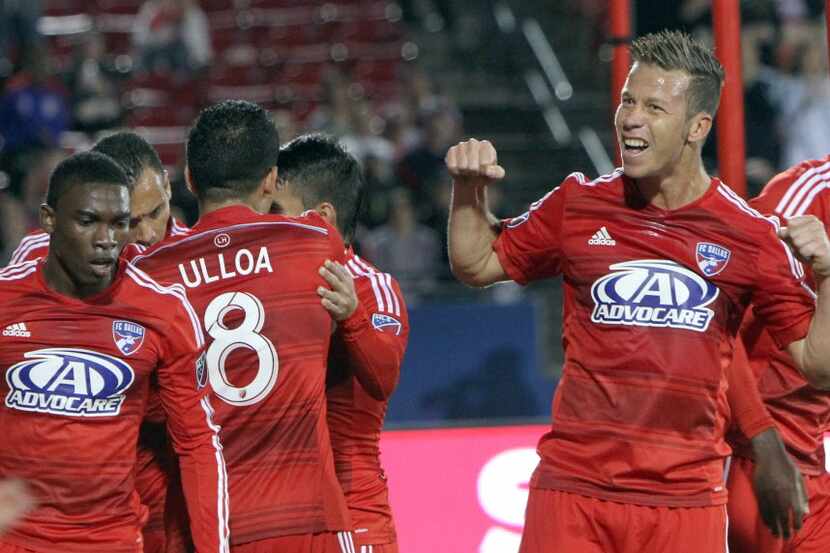 FC Dallas' Michel (31) gestures to fans as he celebrates a first half goal by teammate Blas...