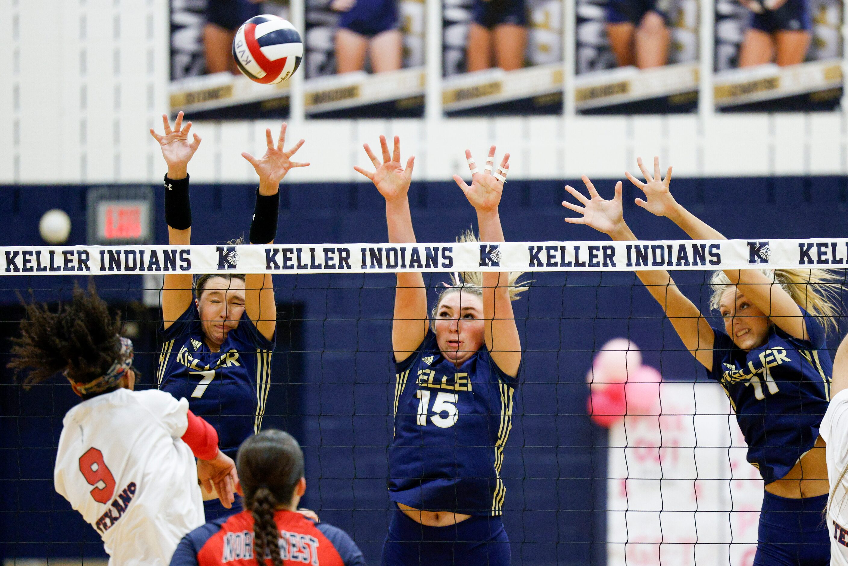 Justin Northwest's Ariah Perez (9) hits over the block of Keller's Carley Wright (7),...