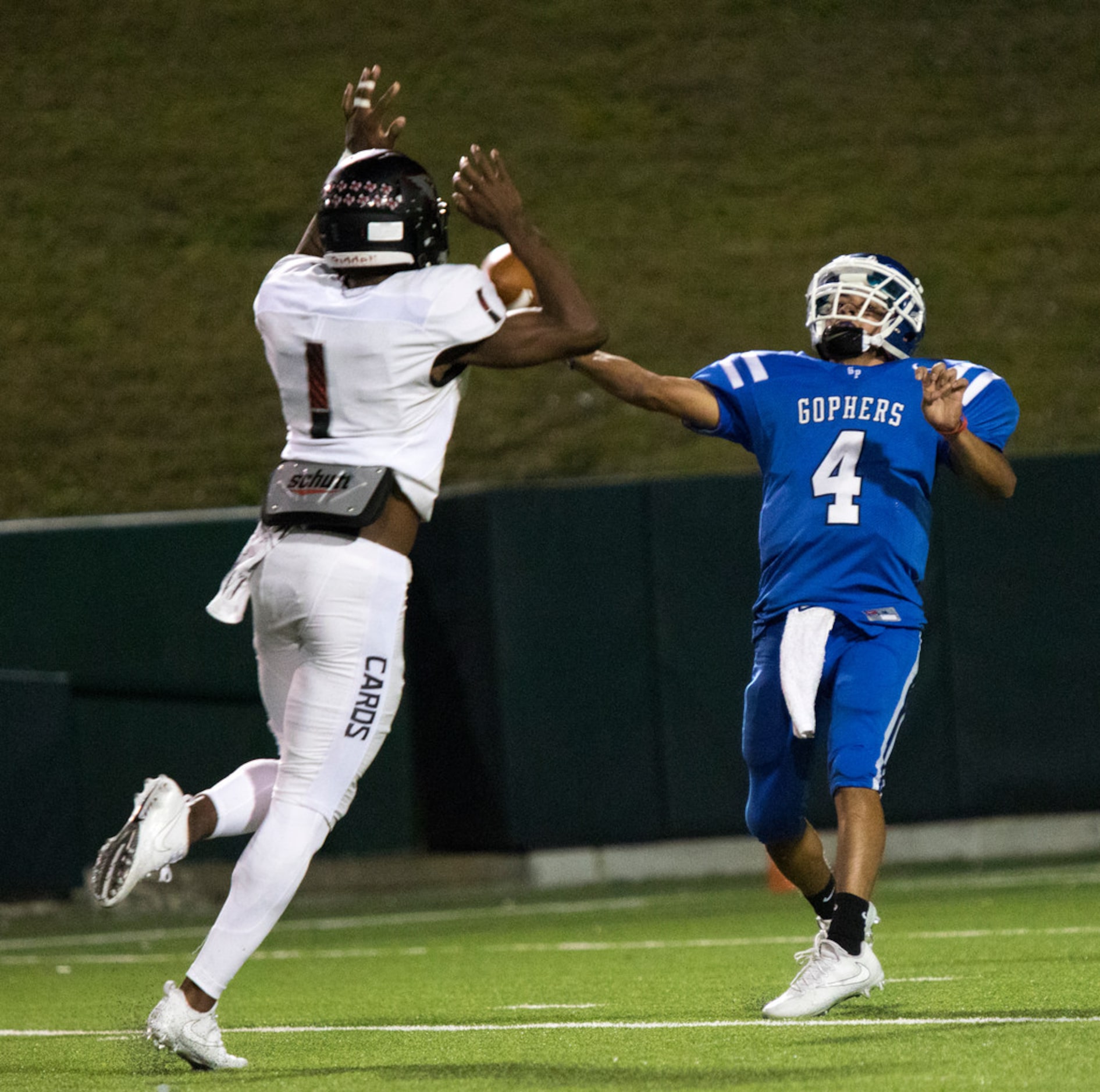 Grand Prairie quarterback Leo Rodriguez (4) passes under pressure during a District 7-6A...