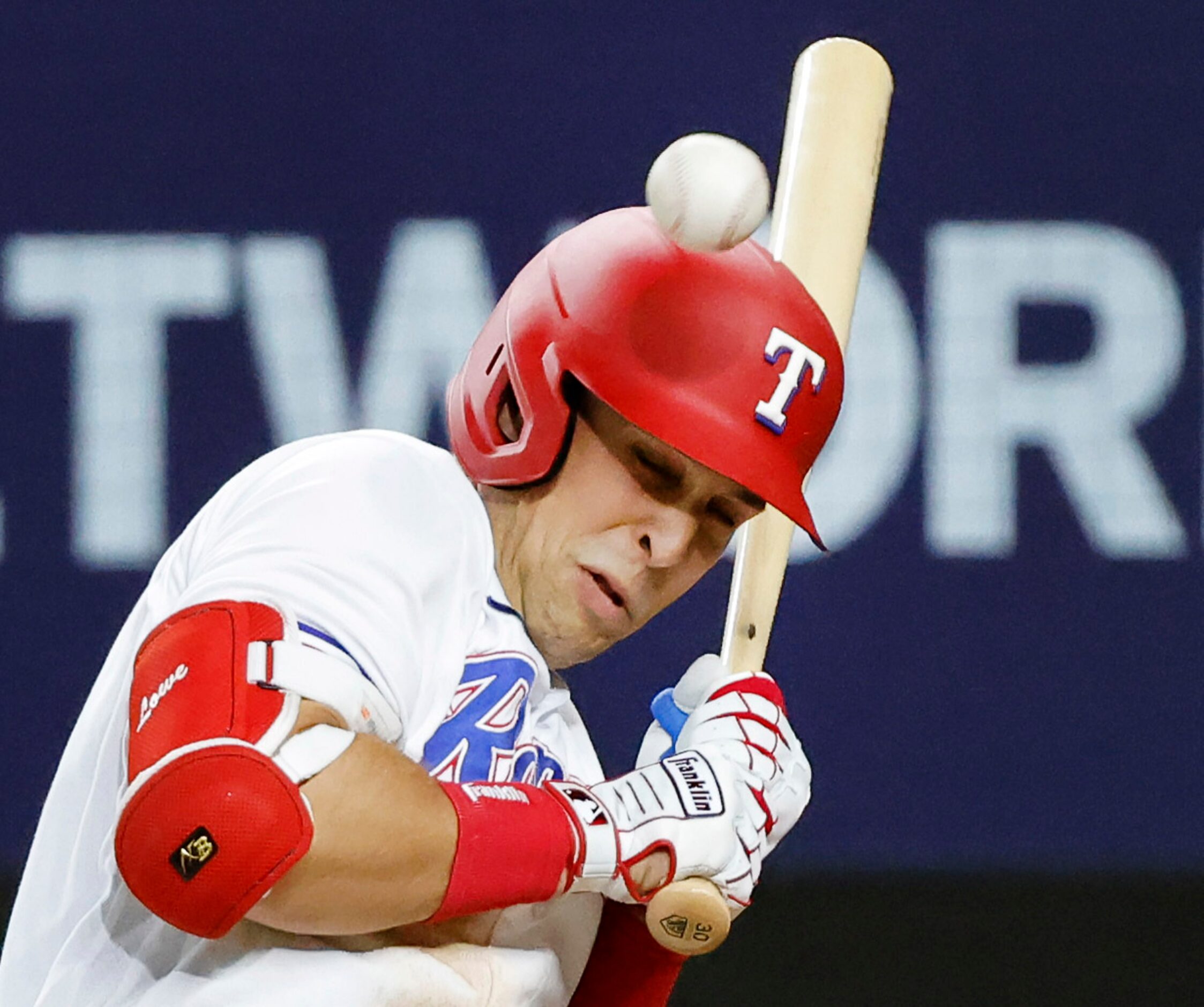 Texas Rangers first baseman Nathaniel Lowe (30) is hit in the shoulder by New York Yankees...