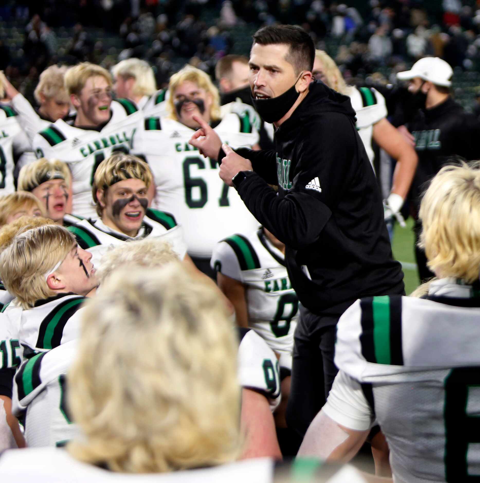 Southlake head coach Riley Dodge speaks with his players following their 30-26 victory over...