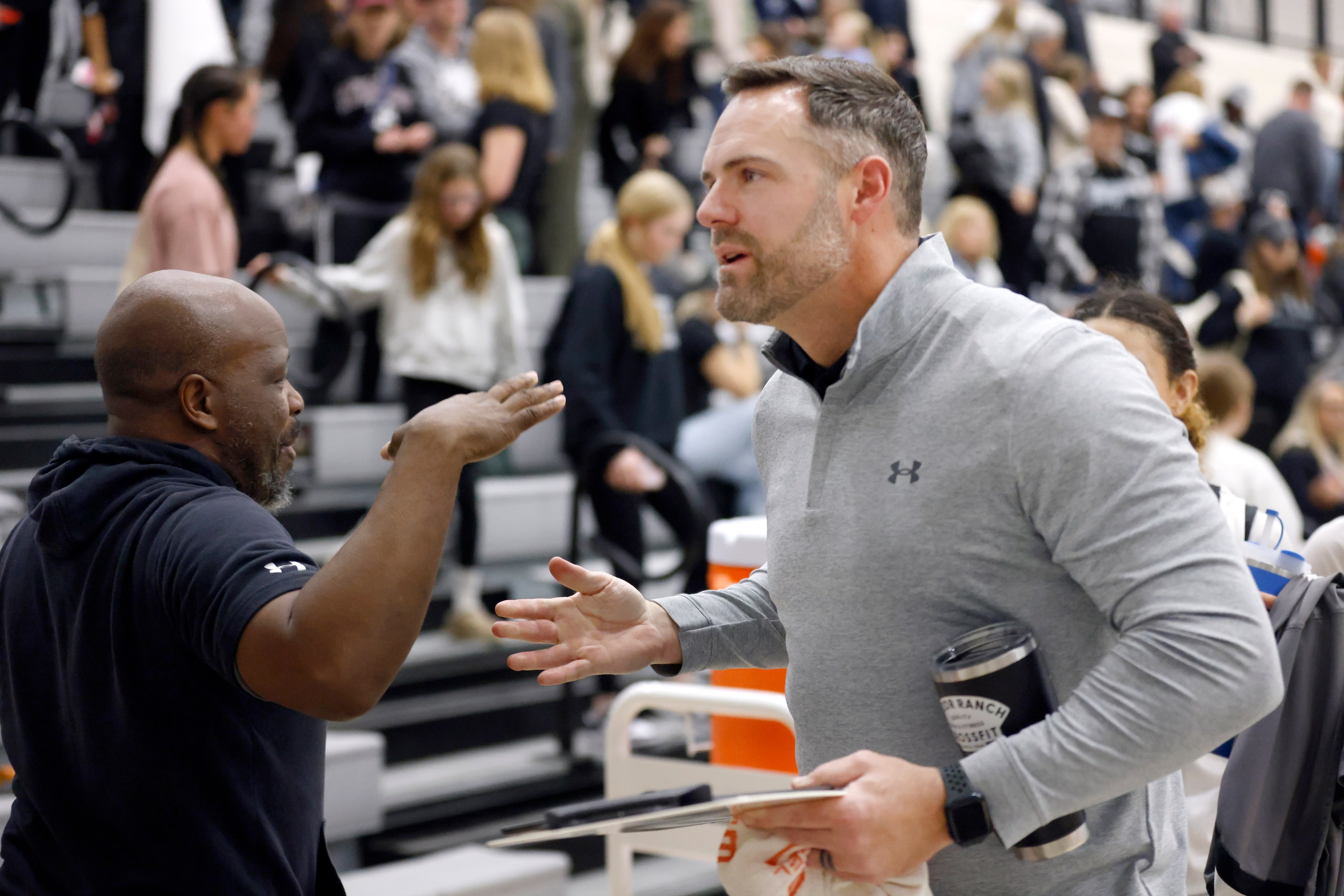 Denton Guyer head coach Jake Floyd (right) is congratulated on their teams 49-47 win over...