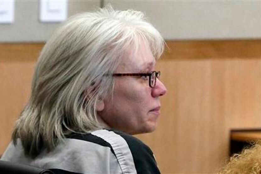 FILE - In this Aug. 1, 2013 file photo, Debra Jean Milke listens to a judge during a hearing...