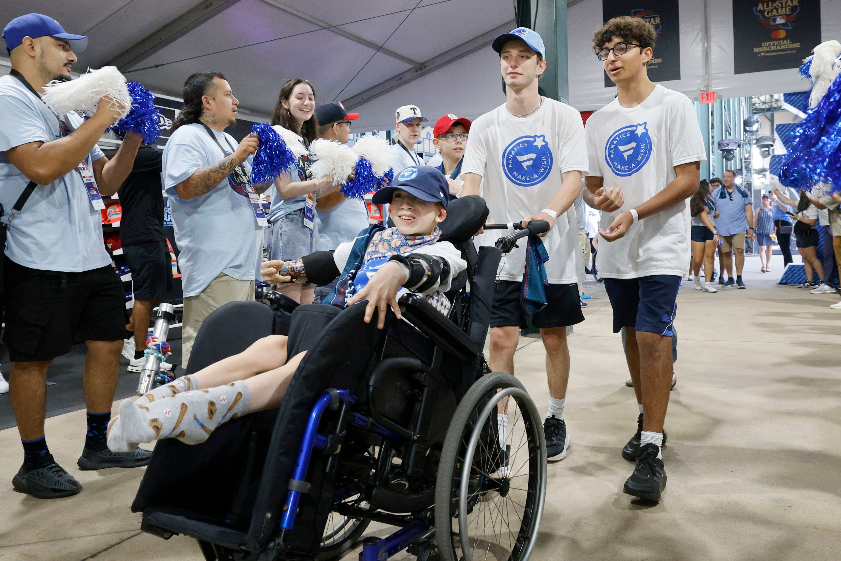 Make-a-Wish kids Holden Sisal, 11, of Toronto, foreground, Tyler Smith, 17 of Park Ridge...