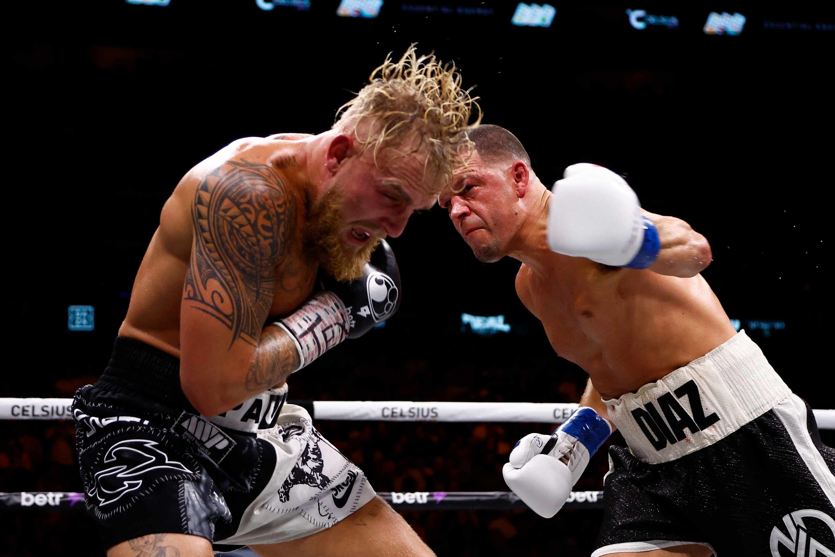 Nate Diaz, right, lands a punch on Jake Paul during a boxing match in Dallas, Saturday,...