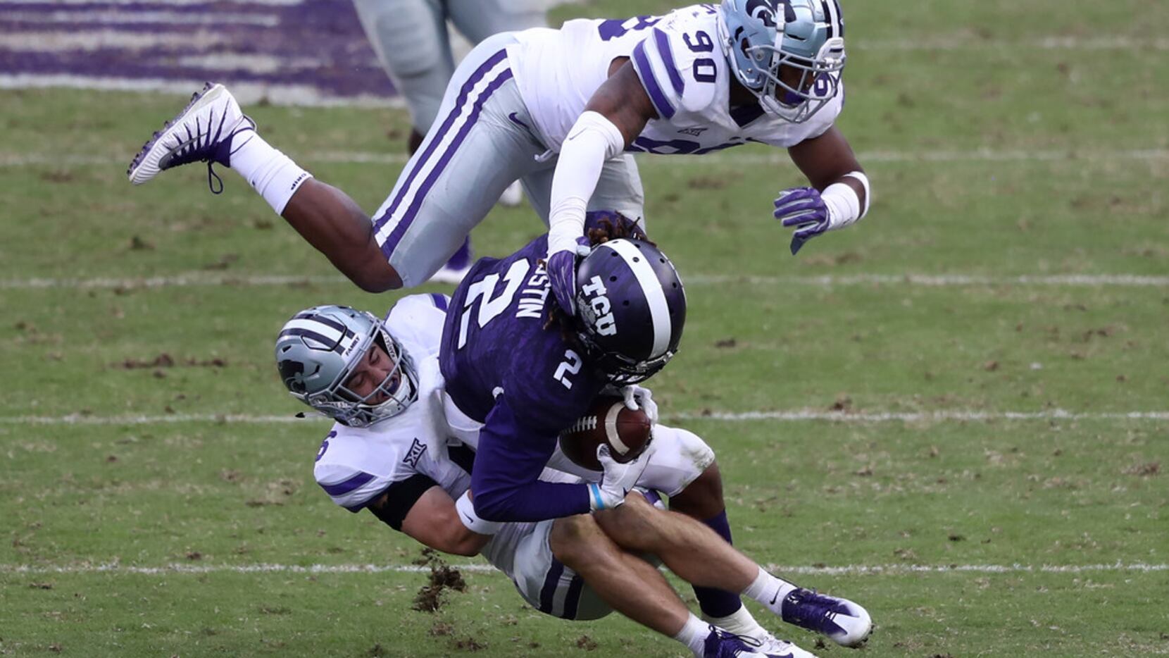 FORT WORTH, TEXAS - NOVEMBER 03:  Jaelan Austin #2 of the TCU Horned Frogs is tackled by...