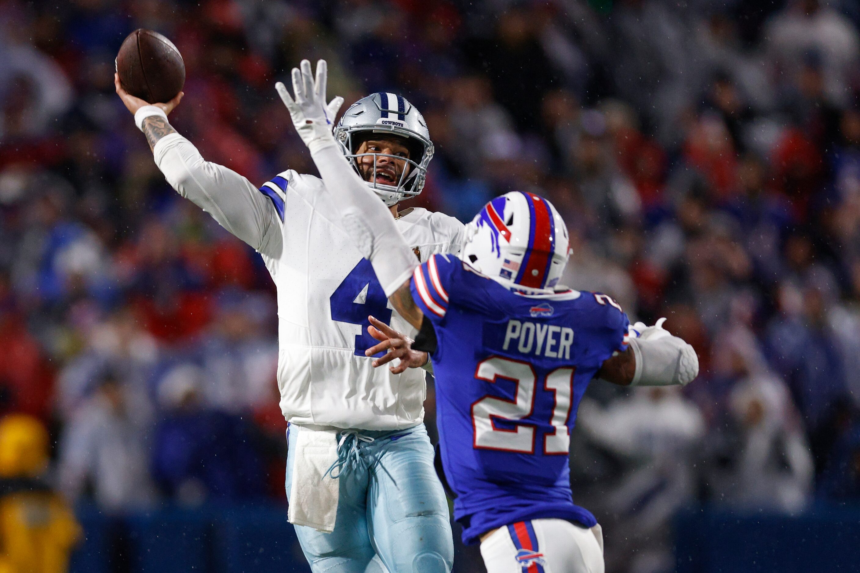 Dallas Cowboys quarterback Dak Prescott (4) throws a pass over Buffalo Bills safety Jordan...