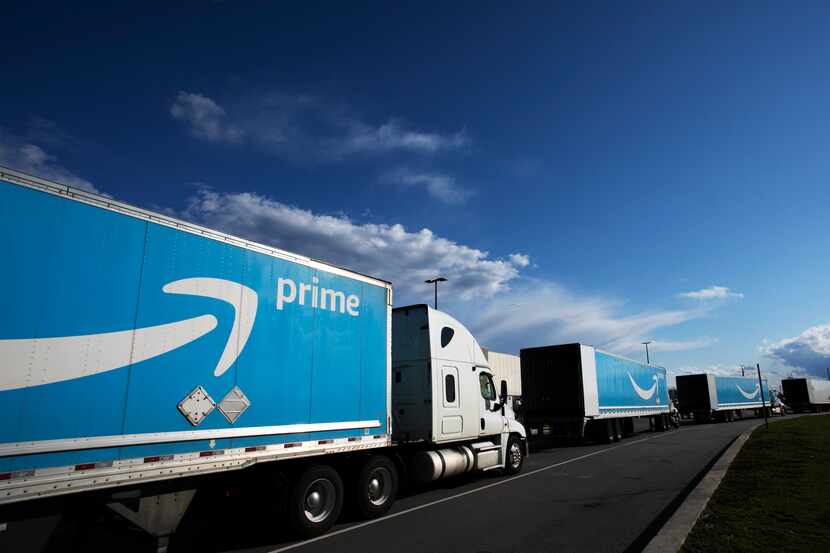 This 2020 file photo shows Amazon tractor trailers lined up outside the Amazon Fulfillment...