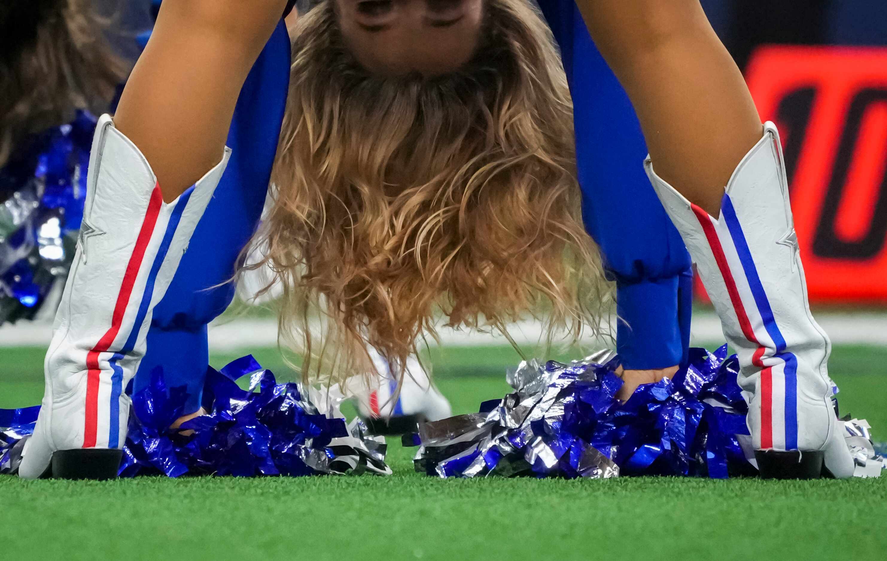 Dallas Cowboys cheerleaders where boots with red, white and blue stripes in recognition of...