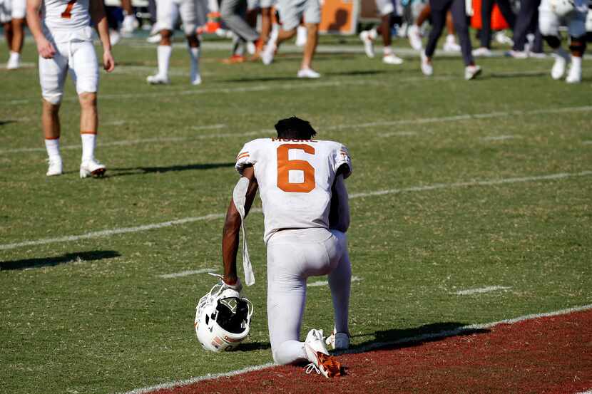 Texas Longhorns wide reciever Joshua Moore (6) takes a knee after they lost to the Oklahoma...