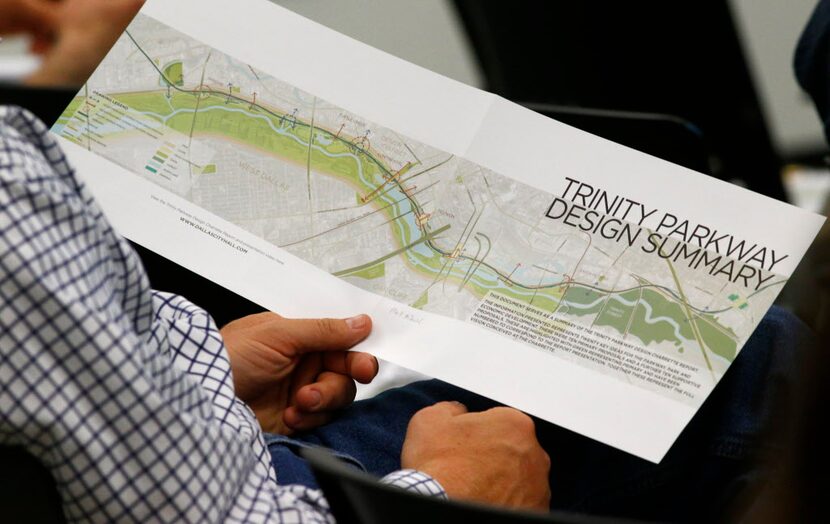  Bill Weinberg looked at a proposal from the Trinity Parkway team of urban experts during a...