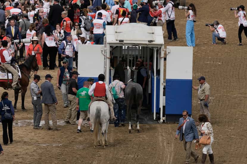 Here Mi Song is taken by an equine ambulance after the 10th horse race at Churchill Downs...