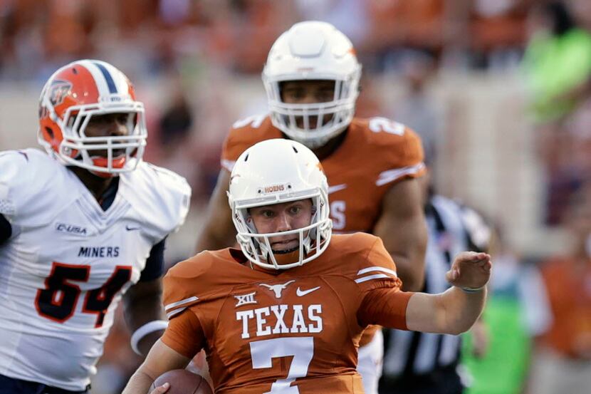Texas quarterback Shane Buechele (7) slides at the end of a run against UTEP during the...