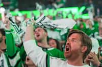 Dallas Stars fans cheer their team before Game 7 of an NHL hockey Stanley Cup first-round...