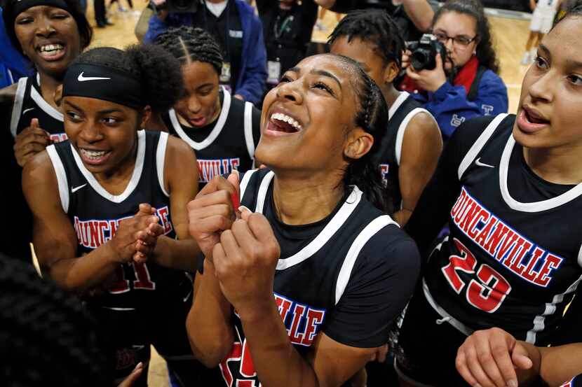 Duncanville guard Deja Kelly #25 celebrates with the rest of the team in a 6A final on ...