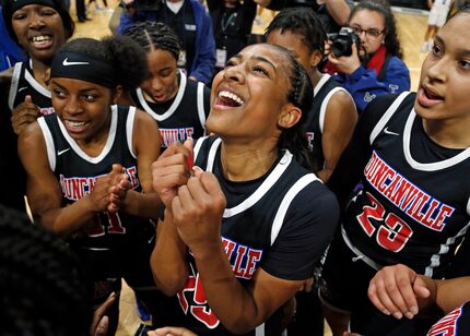 Duncanville guard Deja Kelly #25 celebrates with the rest of the team in a 6A final on ...