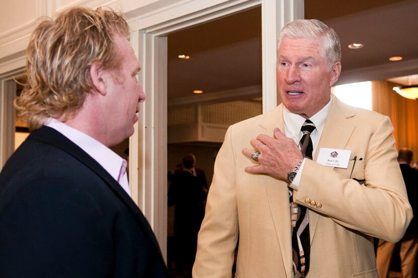 Member of the Hall of Fame Bob Lilly (right) of the Dallas Cowboys from 1961-1974 talks with...