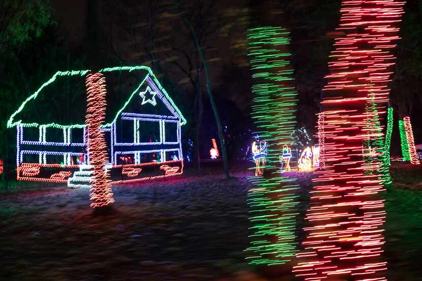 A slow camera shutter shows the Christmas light display at this year's Prairie Lights at...