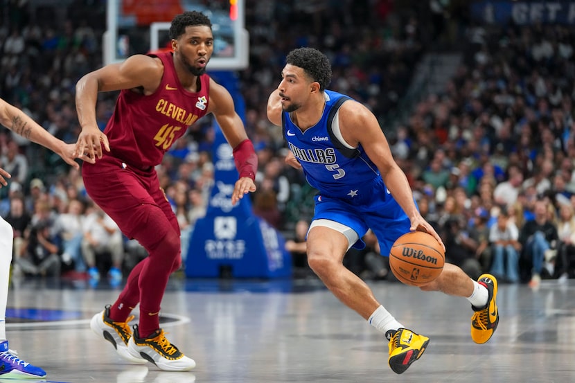 Dallas Mavericks guard Quentin Grimes (5) drives to the basket against Cleveland Cavaliers...