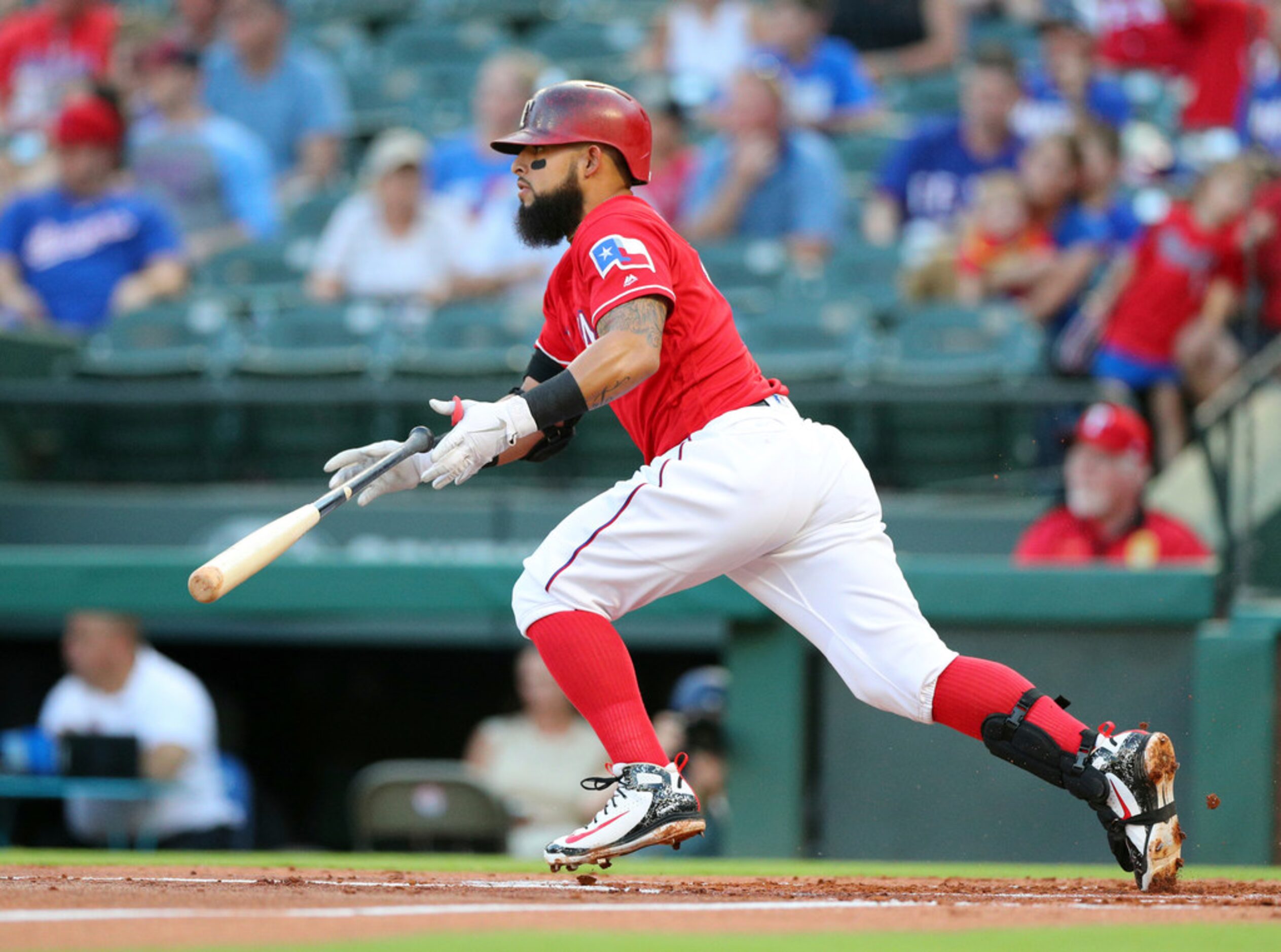 Texas Rangers' Rougned Odor tosses his bat after hitting a single against the Baltimore...