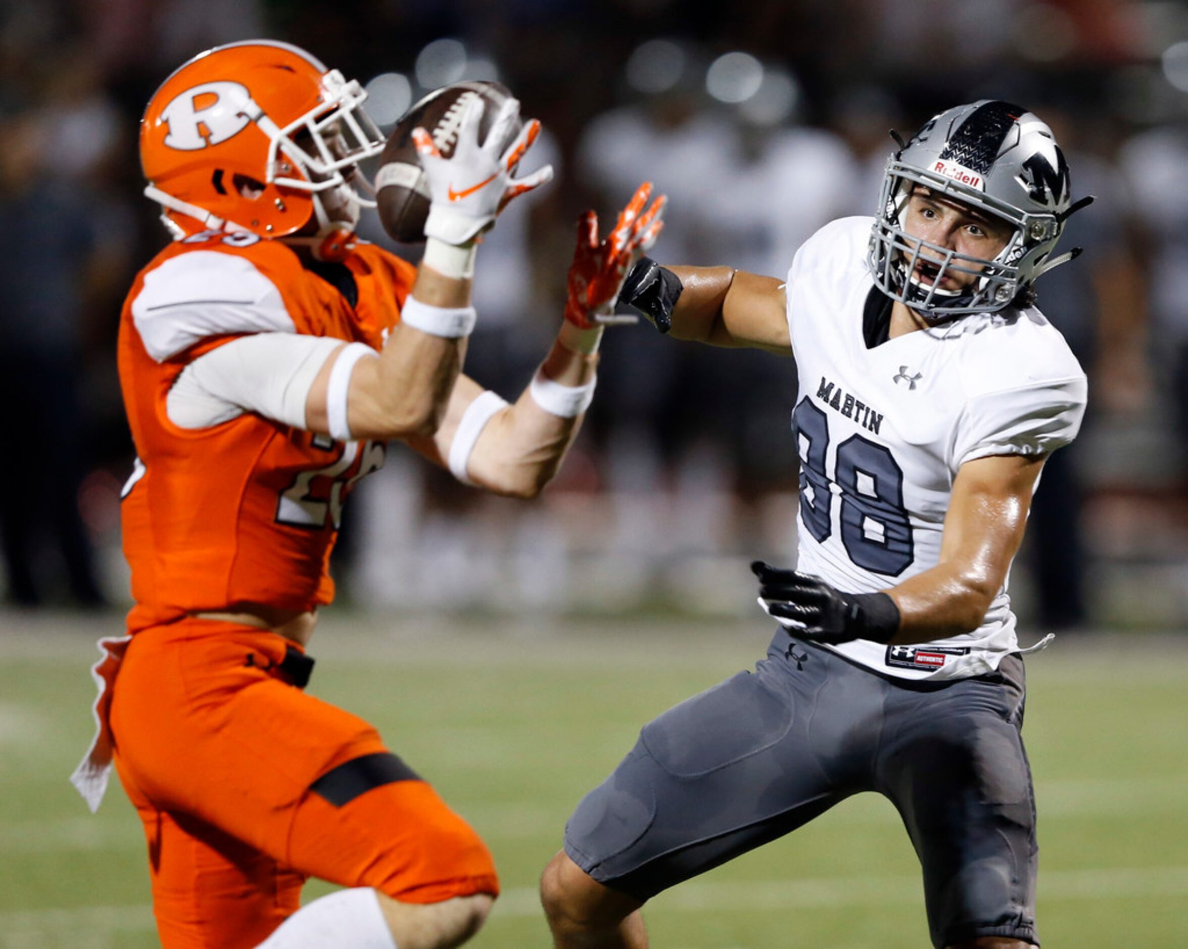 Rockwall's Corey Kelley (25) intercepts a pass intended for  Arlington Martin's Jonathan...