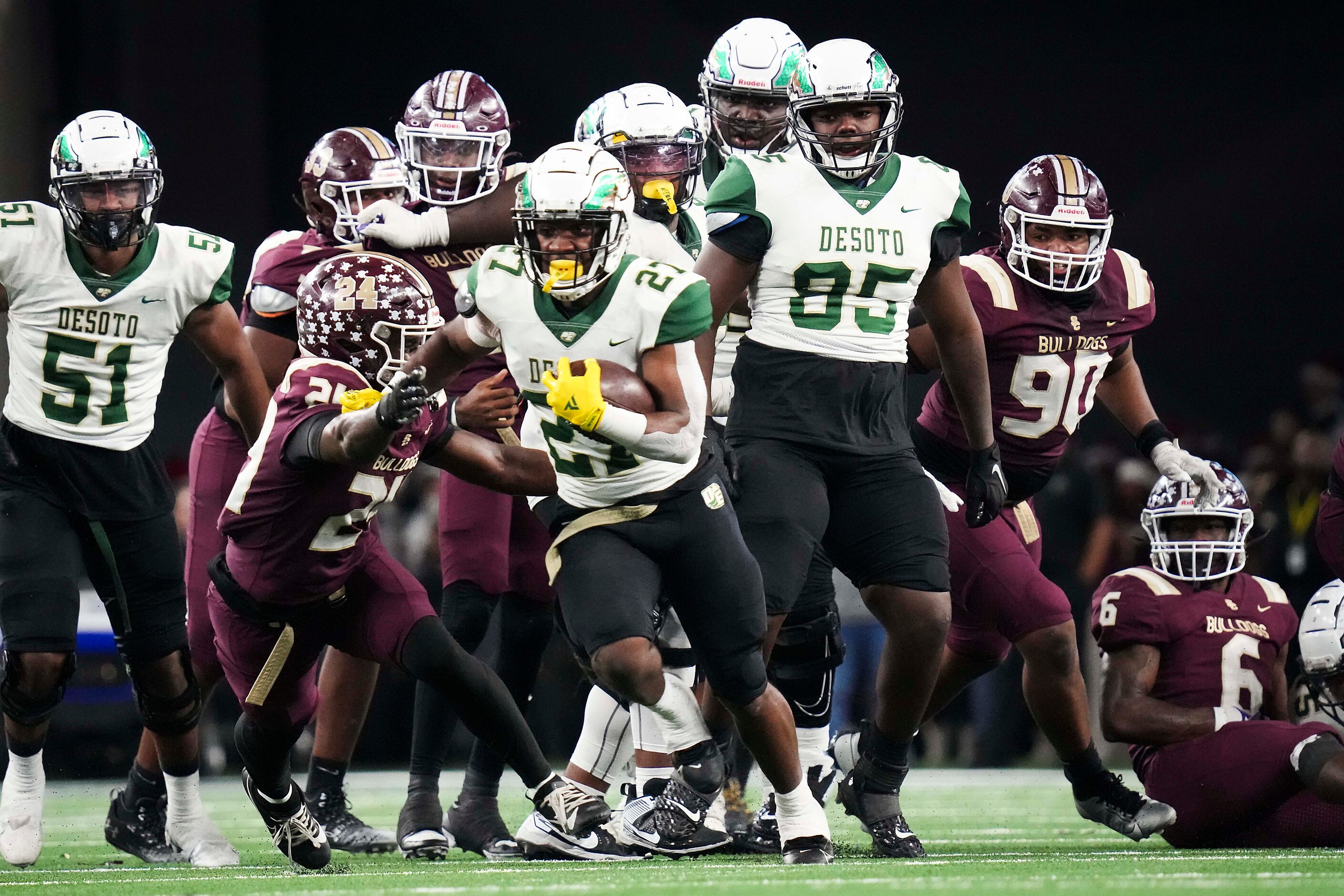 DeSoto running back Marvin Duffey (27) gets past Humble Summer Creek’s Jaylen Carter (24)...