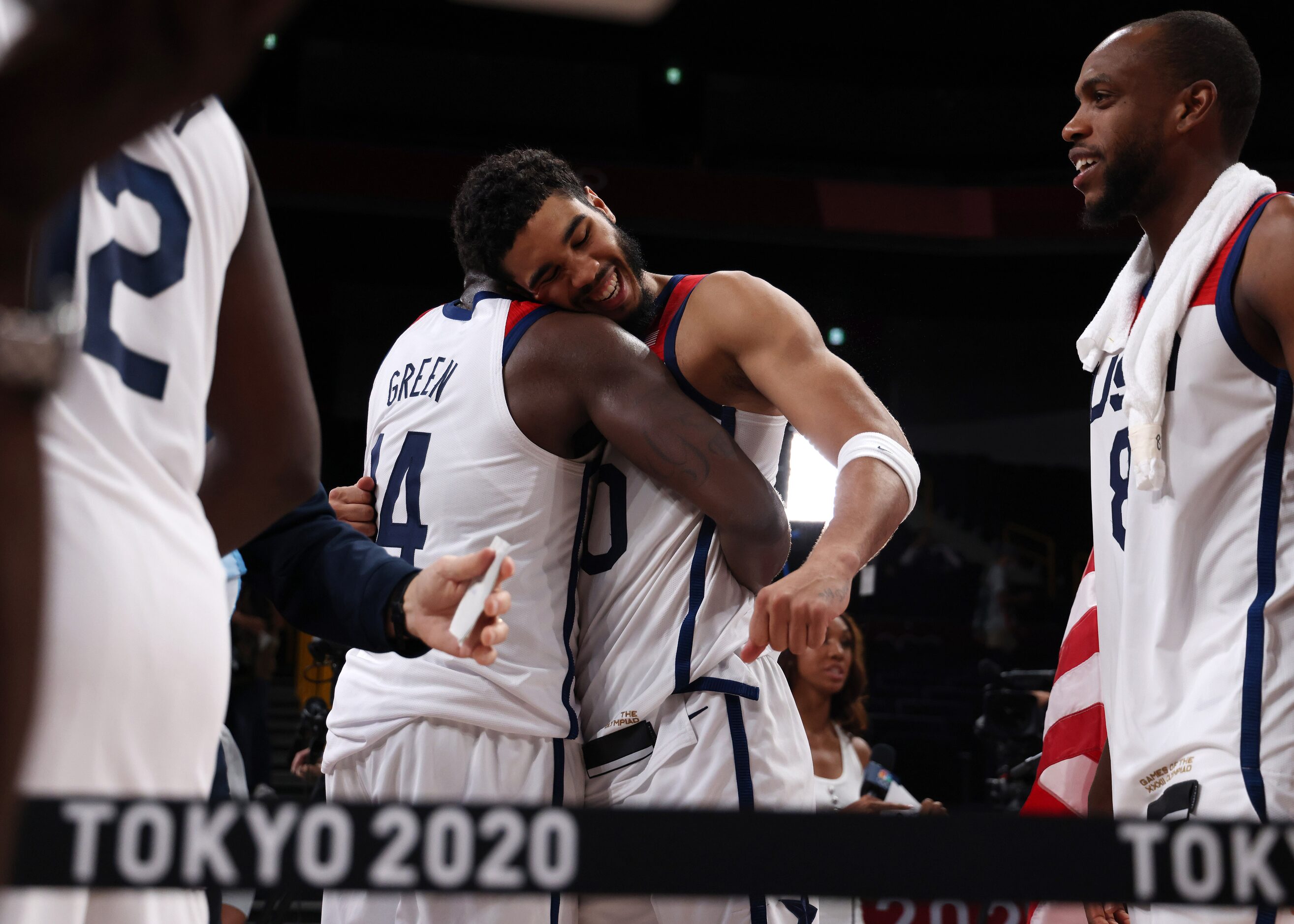 USA’s Jayson Tatum (10) celebrates with Draymond Green (14) teammates after defeating France...