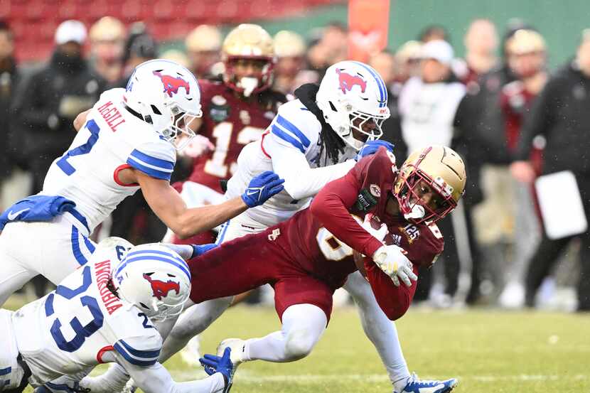Jaedn Skeete #6 of the Boston College Eagles is tackled by safety Isaiah Nwokobia #23 of the...