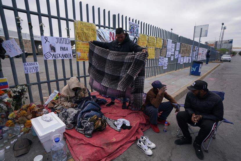 Protest signs cover the fence outside the Mexican immigration detention center that was the...