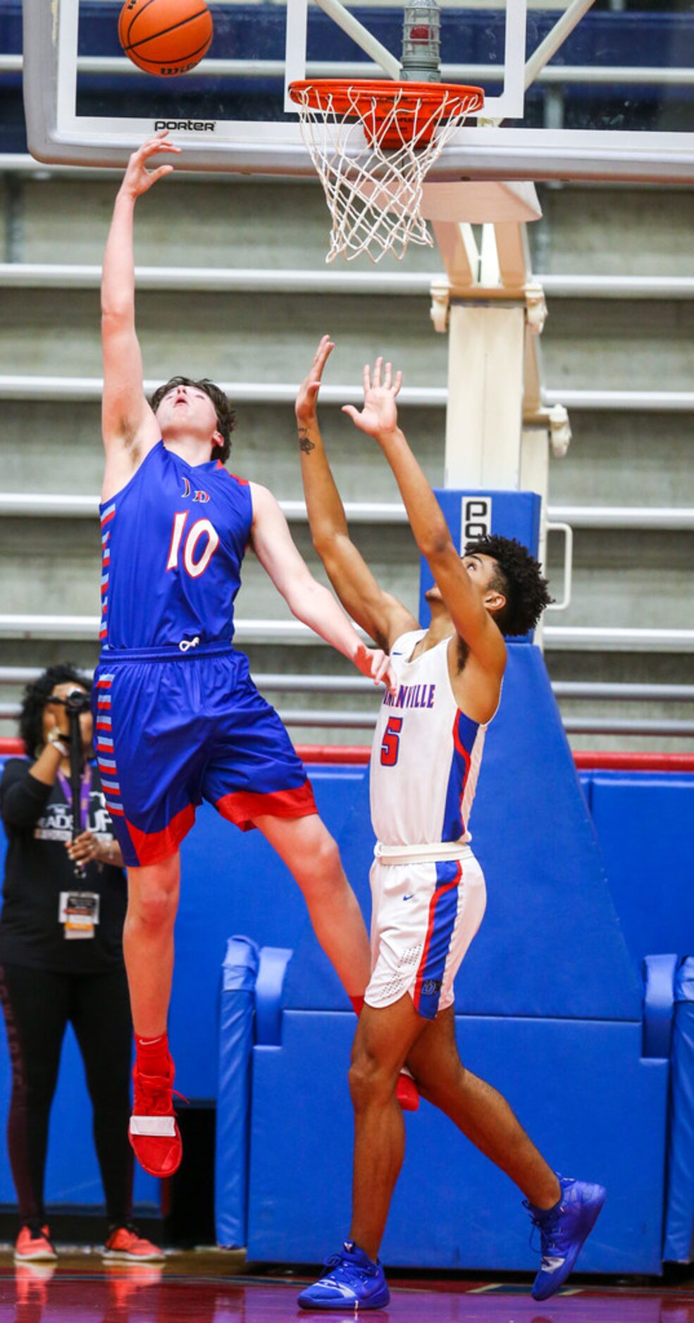 J. J. Pearce forward Walker Timme (10) and Duncanville guard Micah Peavy (5) go for a...