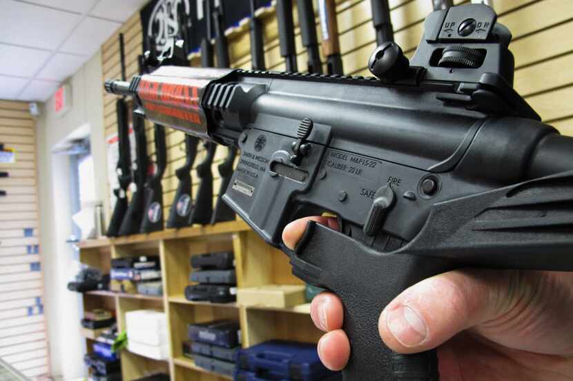 An employee of North Raleigh Guns demonstrates how a "bump stock" works at the Raleigh,...
