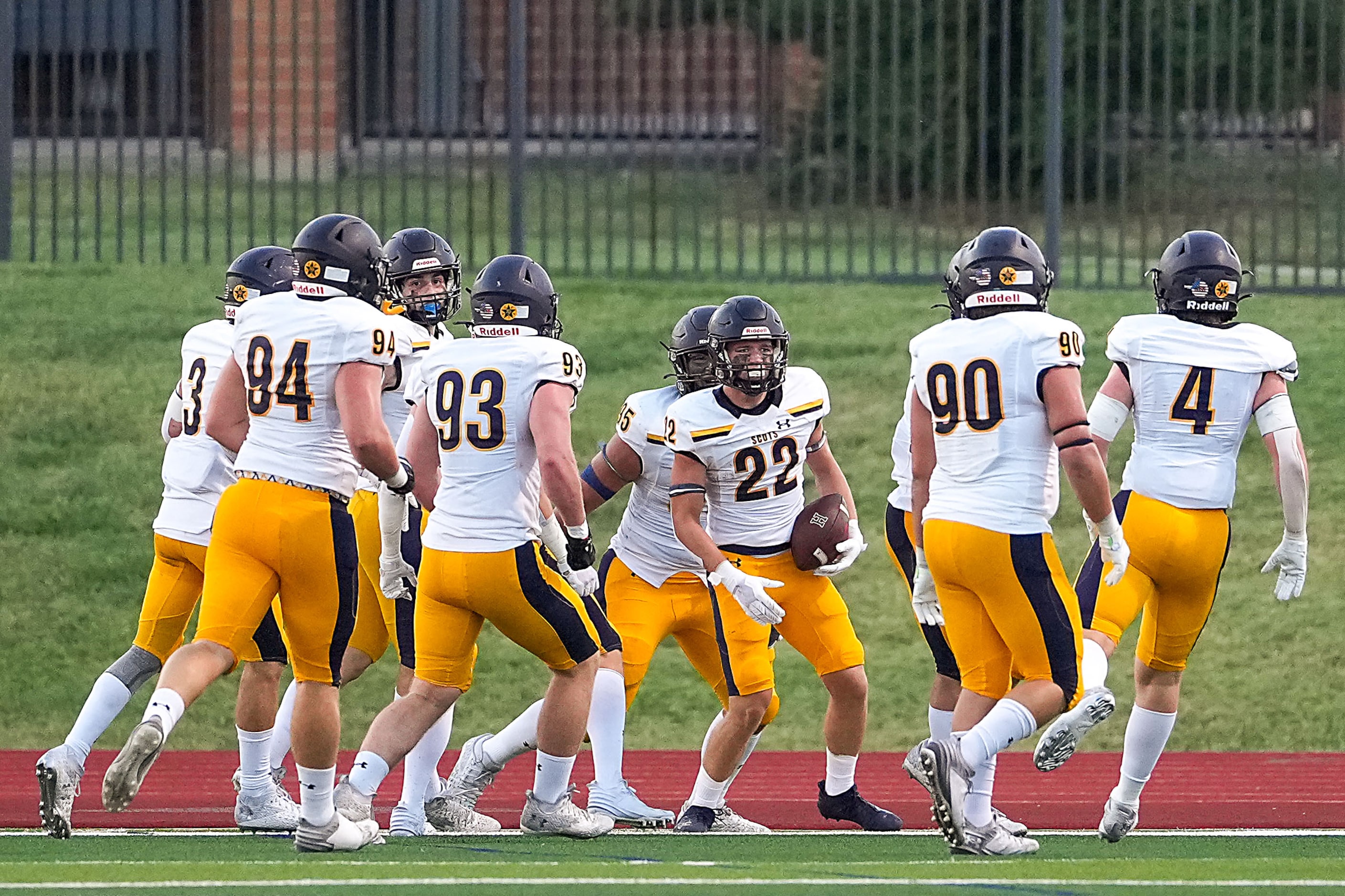 Highland Park cornerback Angus Wall (22) celebrates after returning an interception 98-yards...