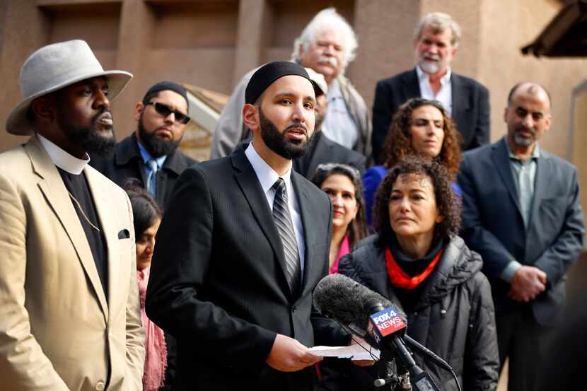 Irving Imam Omar Suleiman defends Muslims outside Irving City Hall on Wednesday. Offering...