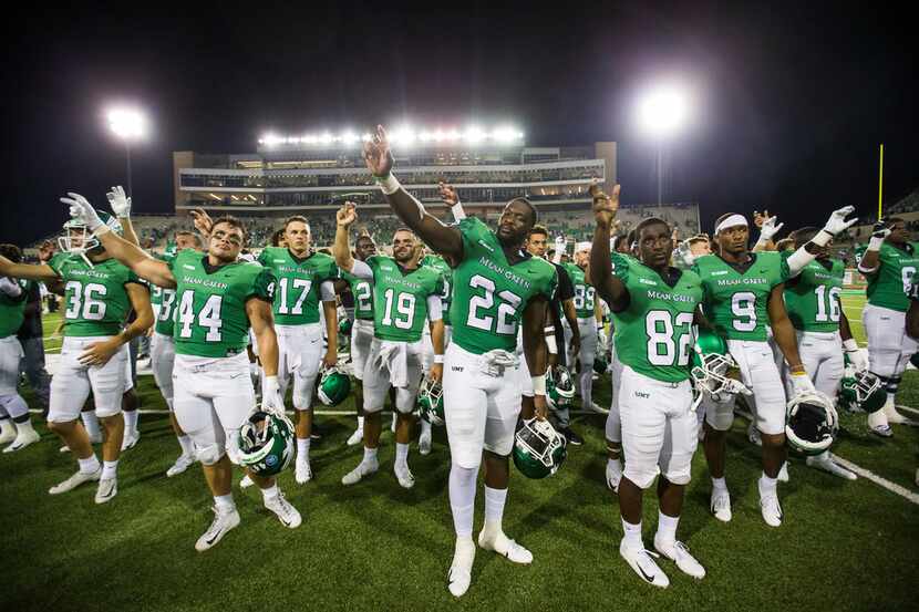 The North Texas Mean Green celebrate following a 46-23 University of North Texas win over...