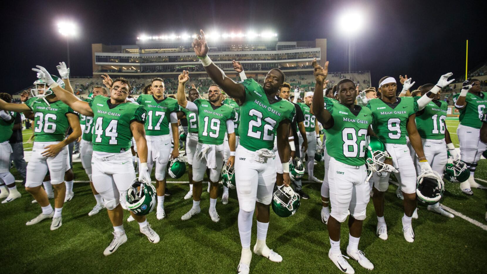 The North Texas Mean Green celebrate following a 46-23 University of North Texas win over...